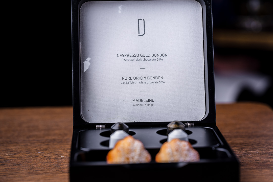 Box with Nespresso capsules and madeleines on a table at Restaurant Daalder in Amsterdam