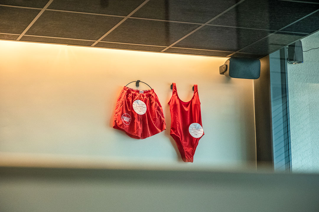 Schwabinger Wahrheit Munich by Geisel by Hungry for More. Spa. Red swimsuits on a wall.