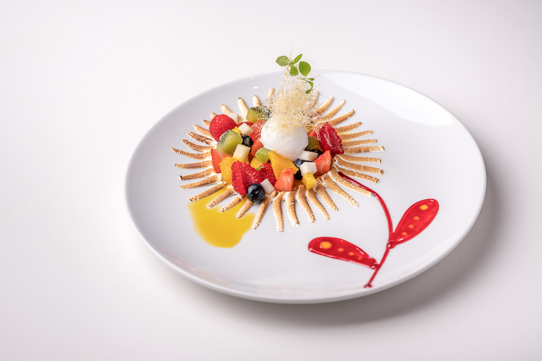 La Truffe Noire by Hungry for More. Top shot of the dessert with meringue and fresh fruit by Luigi Ciciriello.