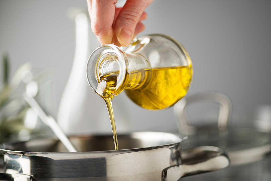 iStock. Cooking with olive oil.