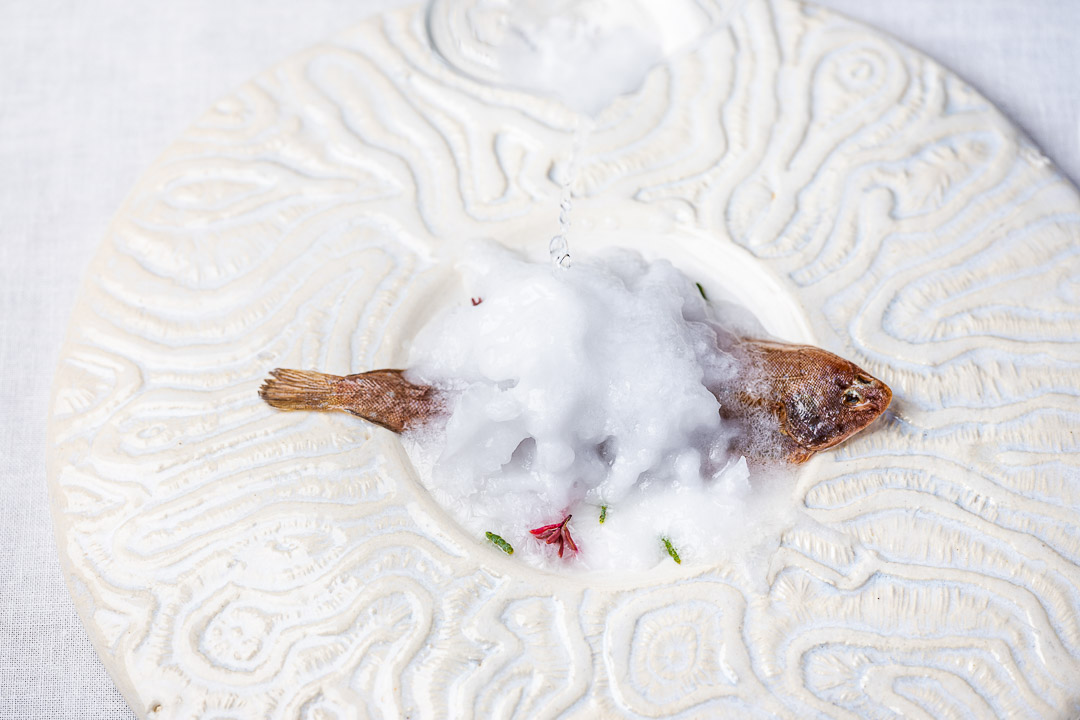 Aponiente by Hungry for More. Spotted flounder fish cooked with Aponiente’s instant sea salt technique and meunière sauce. Technique. Top action view 04.