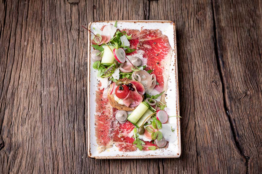 Elckerlijc by Hungry for More. Overall shot of the carpaccio by chef Peter de Clercq.