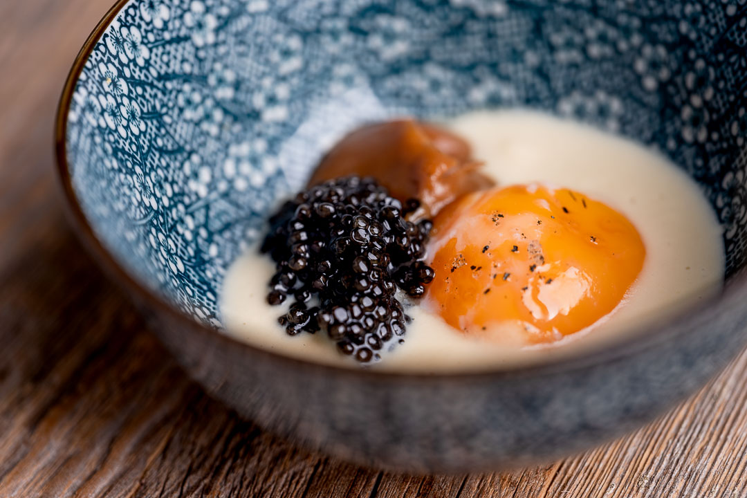 Heritage by Hungry for More. Caviar with egg yolk, corn and onion .